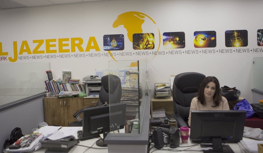 Employees of Al-Jazeera satellite channel at their Jerusalem bureau. Photo: EPA Employees of Al-Jazeera satellite channel at their Jerusalem bureau. Photo: EPA