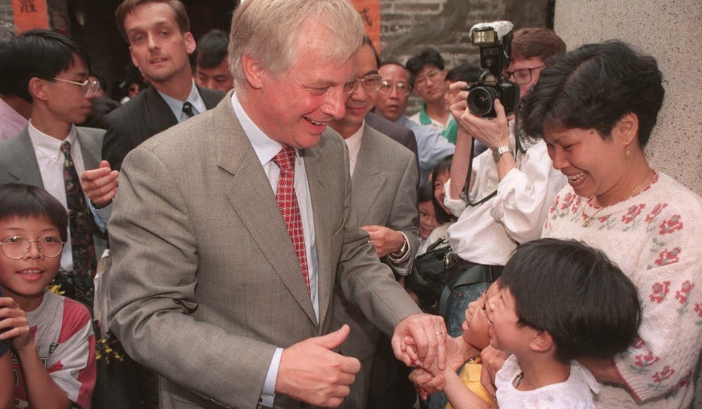 Governor Chris Patten chatting with a child while on tour of the Nam Pin Wai village in Yuen Long. Photo: John Lehmann