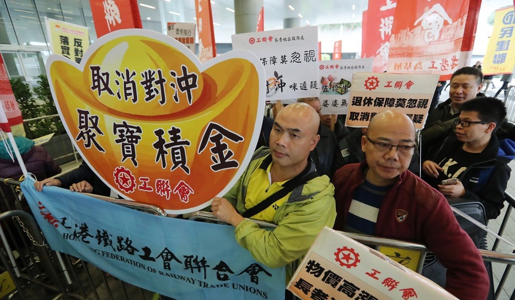 Members of The Hong Kong Federation of Trade Unions protested outside Legco before Leung Chun-ying gave his policy address in January. Photo: Edward Wong