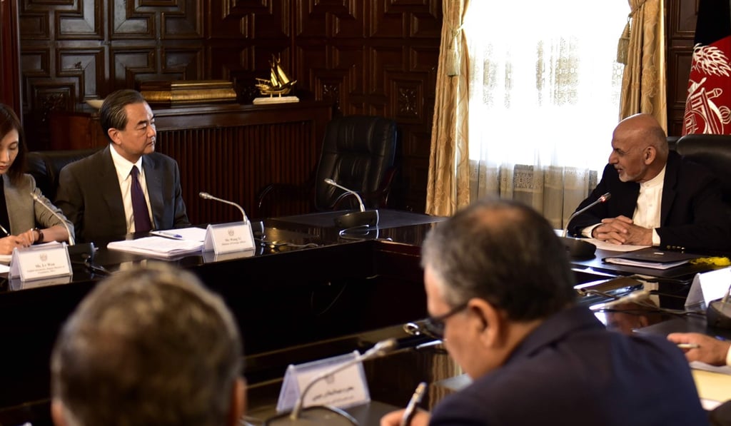 Afghan President Ashraf Ghani (right) talks to Foreign Minister Wang on Saturday. Photo: Xinhua Afghan President Ashraf Ghani (right) talks to Foreign Minister Wang on Saturday. Photo: Xinhua