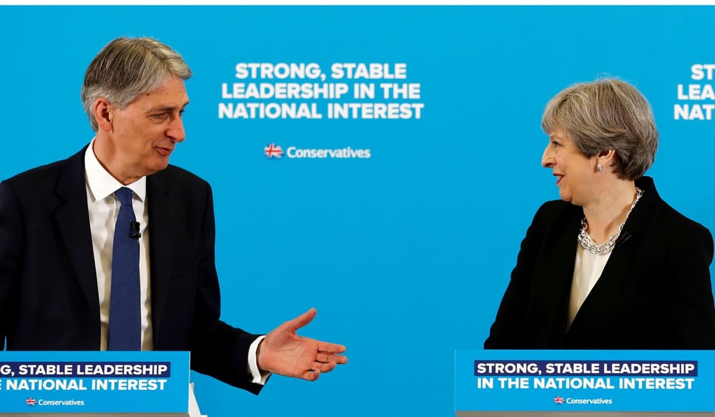 Britain's Prime Minister Theresa May and Chancellor of the Exchequer Philip Hammond. Photo: Reuters