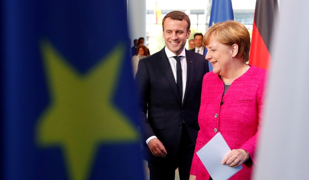 German Chancellor Angela Merkel and French President Emmanuel Macron arrive to a news conference at the Chancellery in Berlin on May 15. Photo: Reuters