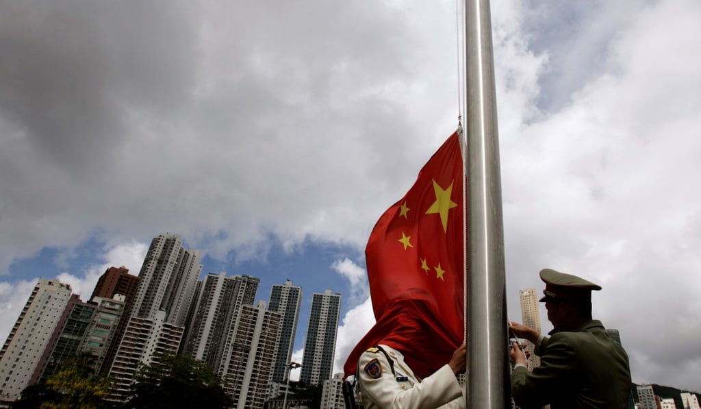 Soldiers in the PLA Hong Kong garrison rehearse a flag-raising ceremony in 2007, ahead of the 10th anniversary of the Hong Kong handover. An understanding of the roles and duties spelt out in the Basic Law would help to clear the confusion over “one country, two systems”. Photo: Reuters