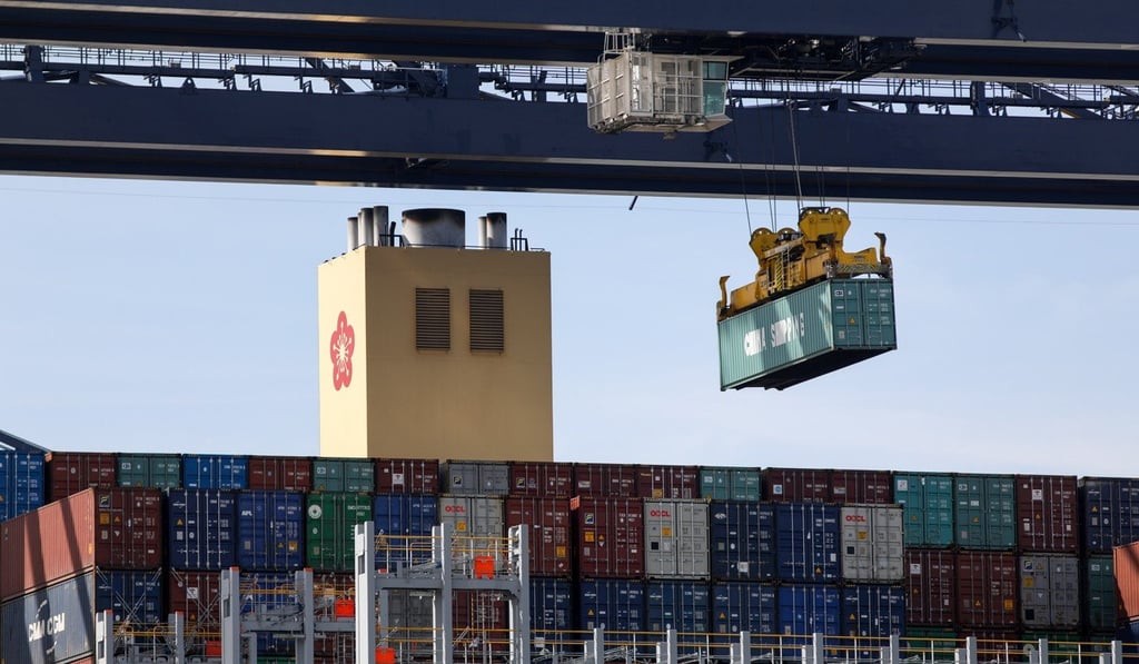 A container is lifted above the Orient Overseas Container Line’s Hong Kong container ship in Britain’s Felixstowe port. Photo: Bloomberg A container is lifted above the Orient Overseas Container Line’s Hong Kong container ship in Britain’s Felixstowe port. Photo: Bloomberg