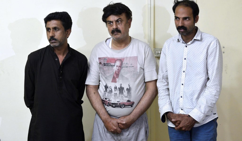 Arrested doctor Fawad Mumtaz (centre) and his assistants, who were conducting unauthorised surgeries for international clients. Photo: AFP Arrested doctor Fawad Mumtaz (centre) and his assistants, who were conducting unauthorised surgeries for international clients. Photo: AFP