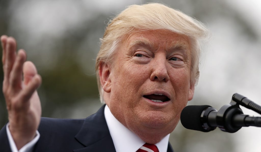 President Donald Trump speaks on the South Lawn of the White House in Washington. A limited version of his travel ban was allowed by the US Supreme Court. Photo: AP