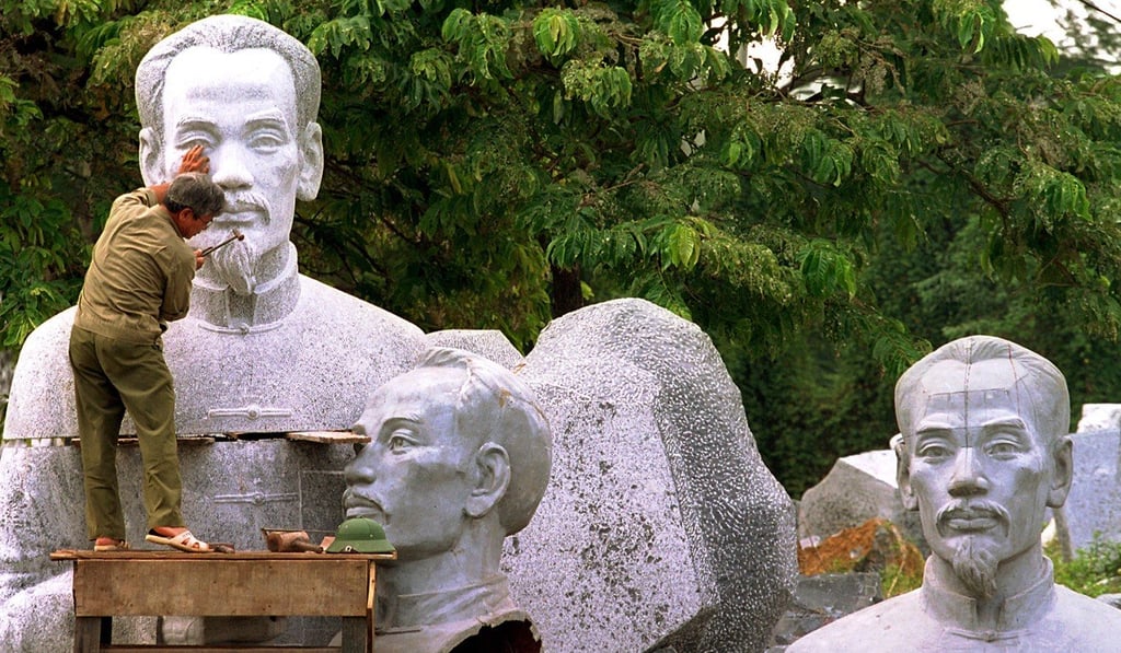 A man works on a giant sculpture of Ho Chi Minh at the Air Force Museum in Hanoi in October 1999. Ho Chi Minh had written in his will that, after Vietnam was unified, his cremated ashes should be scattered across North and South Vietnam. Vietnam has been unified for decades, but it does not look like his body will be cremated any time soon. Photo: AP