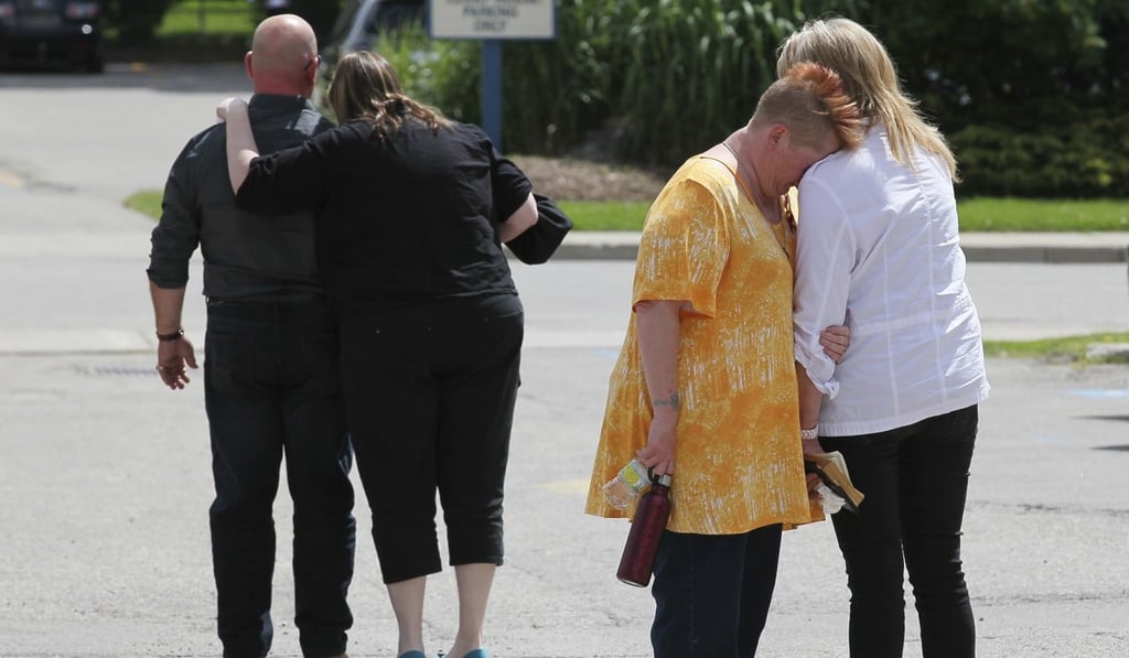 Family members lean on each other for support after reading their impact statements to the court at the sentencing of Elizabeth Wettlaufer, in Woodstock, Ontario. Photo: AP