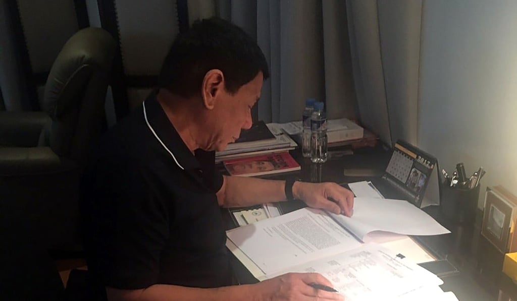 Duterte’s closest aide Christopher Bong’ Go, on June 15 posted images on social media of the Philippine president reading documents. File photo: AFP