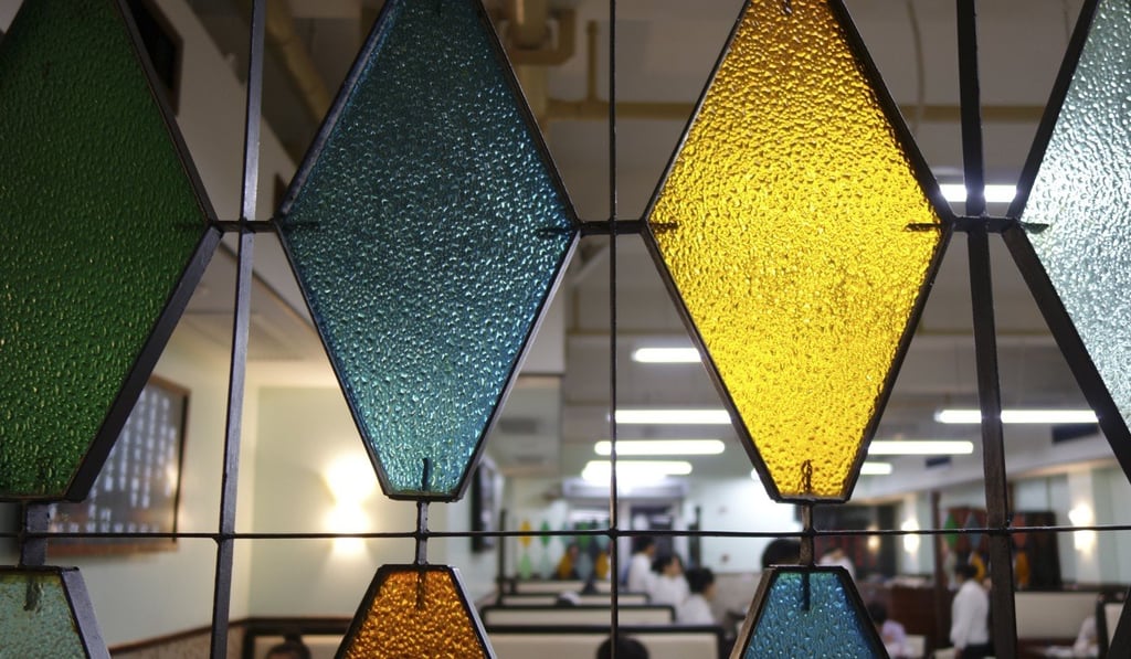 Stained glass adds to the mid-century feel of Cha’s in Shanghai. Photo: Juli Min