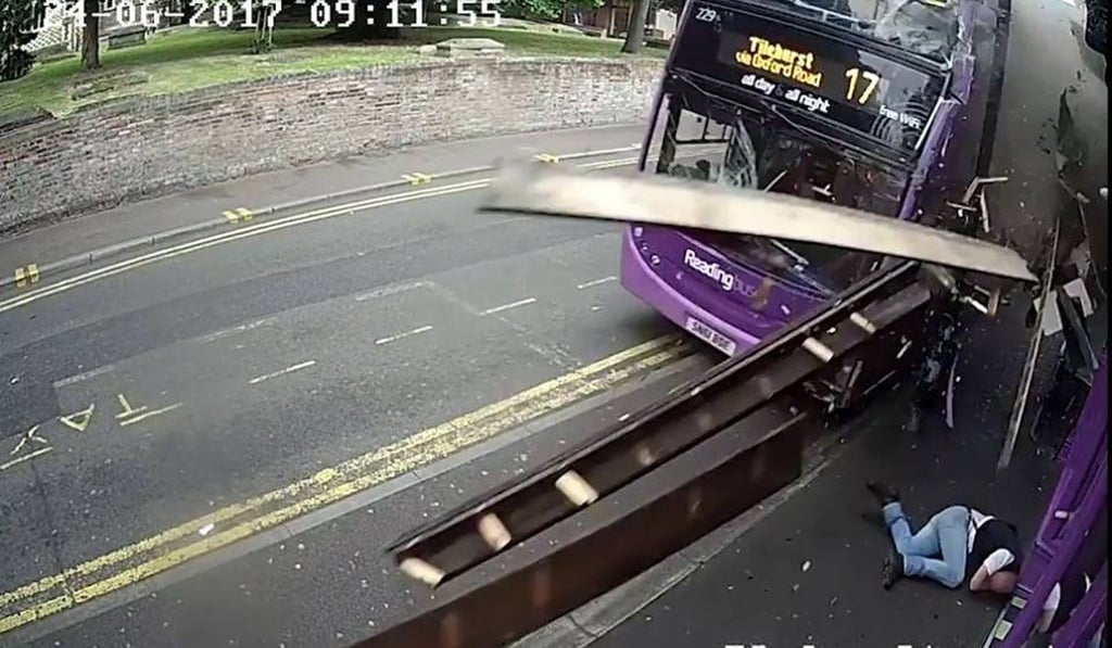 Debris showers past the CCTV camera as the bus passes perilously close to the poleaxed pedestrian. Photo: BBC / YouTube Debris showers past the CCTV camera as the bus passes perilously close to the poleaxed pedestrian. Photo: BBC / YouTube