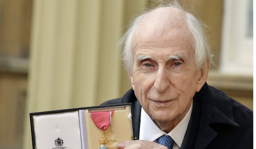 Michael Bond poses with his Commander of the Order of the British Empire (CBE) in 2015. Photo: AP Michael Bond poses with his Commander of the Order of the British Empire (CBE) in 2015. Photo: AP