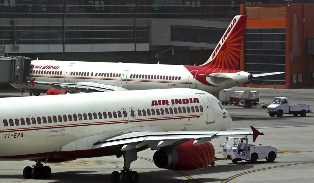 Air India planes are parked on the tarmac at the Terminal 3 of Indira Gandhi International Airport in New Delhi, India. India's federal cabinet has approved a plan to privatise the debt-ridden national carrier. Photo: AP e)