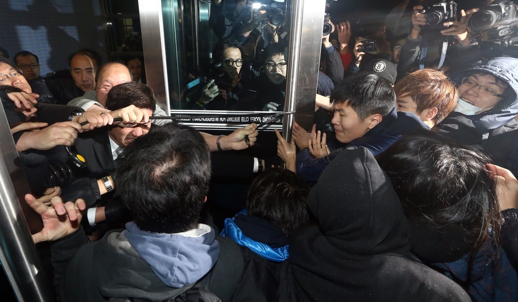 Protesting students try to break into a Hong Kong Jockey Club building on Sassoon Road in Pok Fu Lam, where HKU governing council chairman Arthur Li is in attendance. Photo: Sam Tsang