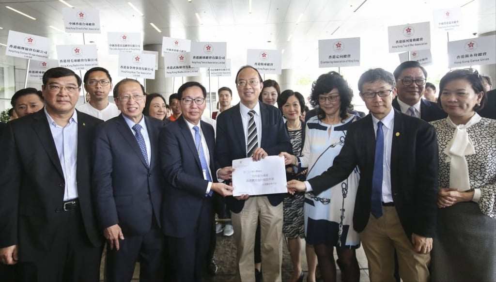 (From left to right) Tong Wai-lun; Olympic Committee vice-president Pui Kwan-kay; Committee chairman Chan Kin-por; Ma Fung-kok; Vivien Lau Chiang-chu; Tony Yue Kwok-leung; and Priscilla Leung as the petition from 73 national sports associations was handed to the committee Chairman urging officials to sign off on the long-delayed Kai Tak Sports. Photo: David Wong