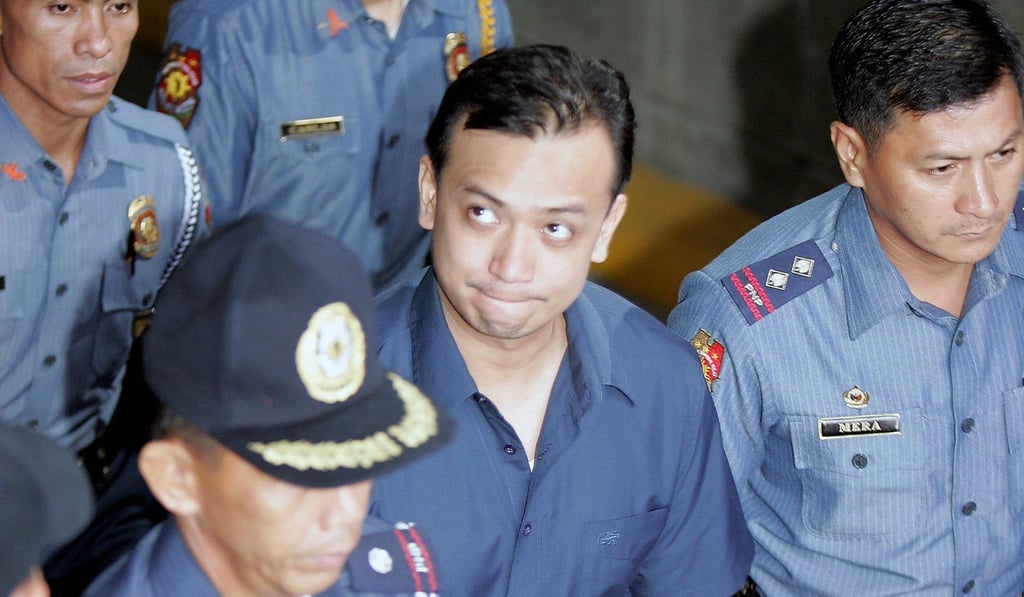 Former Navy lieutenant and now Senator Antonio Trillanes leaves the Makati city trial court during his trial for a failed coup in July 2003. Photo: AP