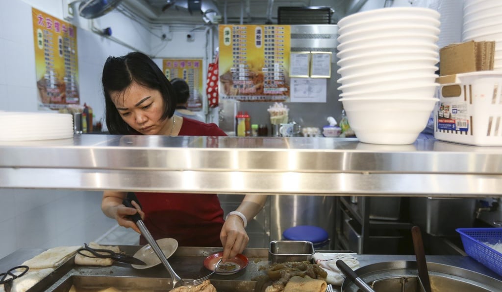 A shopkeeper prepares a tasty snack in Tai On Building. Photo: Xiaomei Chen