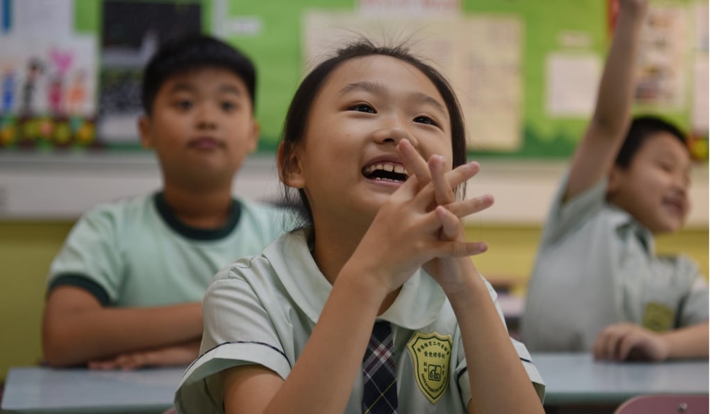 Students in a Hong Kong school attend class in May. According to the OECD’s Pisa rankings, Hong Kong students are ninth in science, and second in both reading and maths. Singaporean students are ranked first in all three measures. Photo: Xinhua