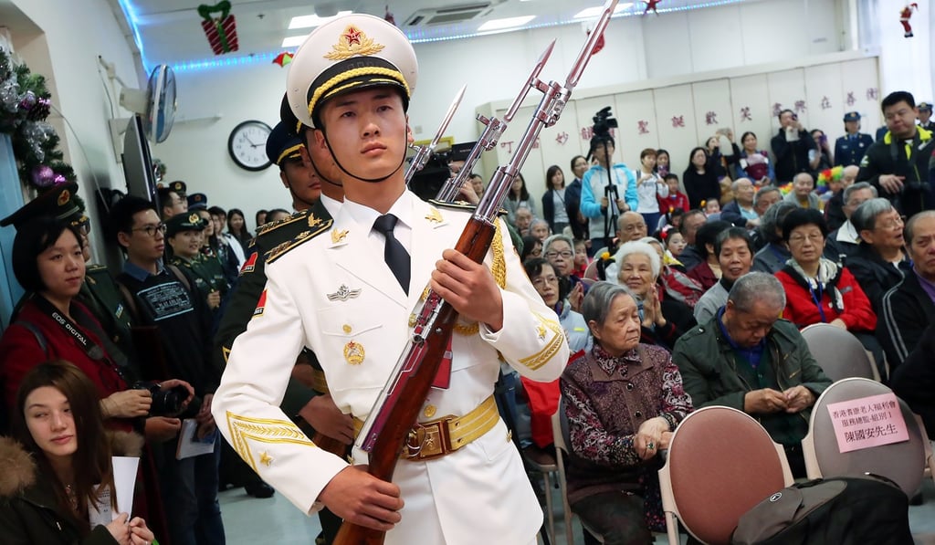 PLA members visit the Hong Kong Society for Aged’s SAGE Madam Ho Sin Hang Home for The Elderly in Pok Fu Lam in December 2015. Photo: David Wong