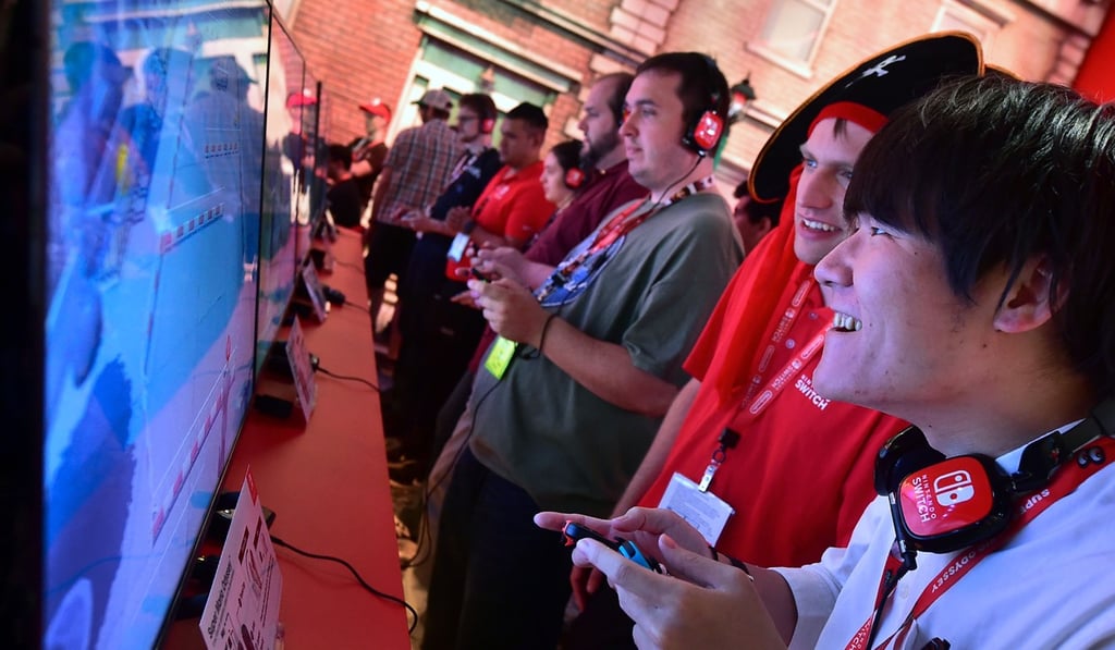 Fans play Super Mario Odyssey on the Nintendo Switch on the first day of E3 2017. Photo: AFP Fans play Super Mario Odyssey on the Nintendo Switch on the first day of E3 2017. Photo: AFP