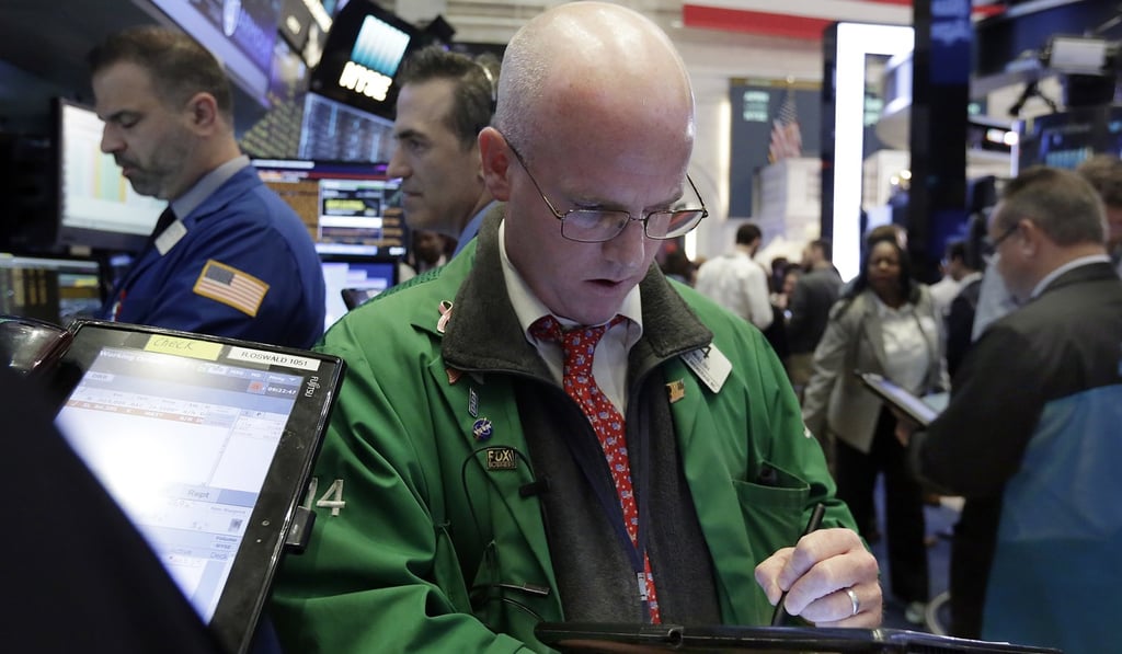 Trader Kevin Walsh works on the floor of the New York Stock Exchange, Thursday, June 29, 2017. US stock indexes ended the day lower as tech shares were hit during the session. Photo: AP Trader Kevin Walsh works on the floor of the New York Stock Exchange, Thursday, June 29, 2017. US stock indexes ended the day lower as tech shares were hit during the session. Photo: AP