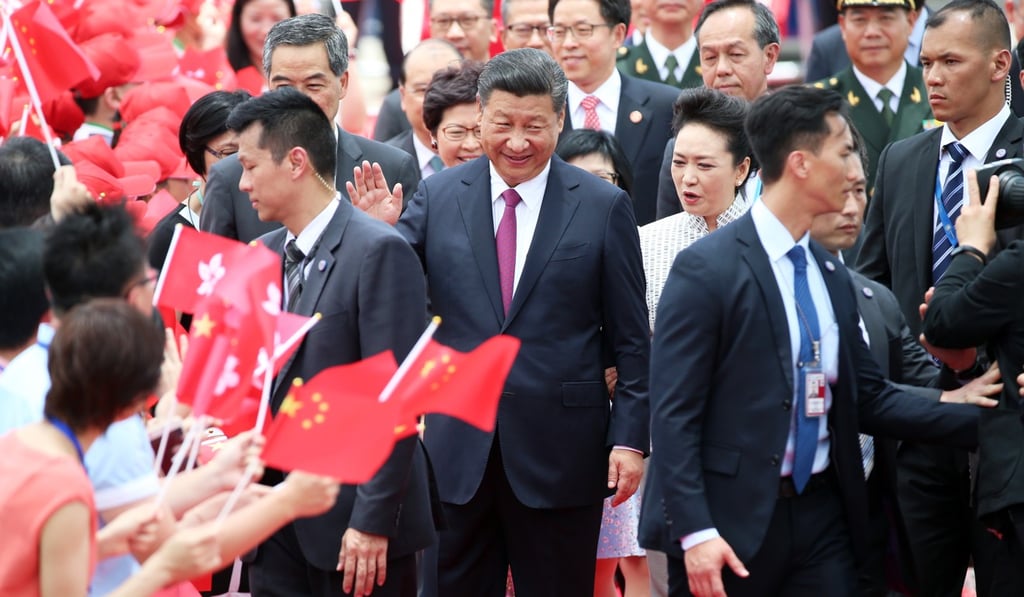 President Xi Jinping and his wife Peng Liyuan arrive at the airport in Hong Kong. Photo: K. Y. Cheng