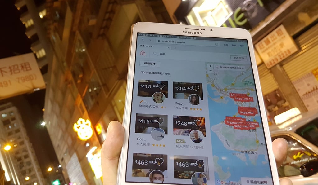A tourist is checking Airbnb with his mobile devise in Causeway Bay, Hong Kong. Photo: Martin Chan