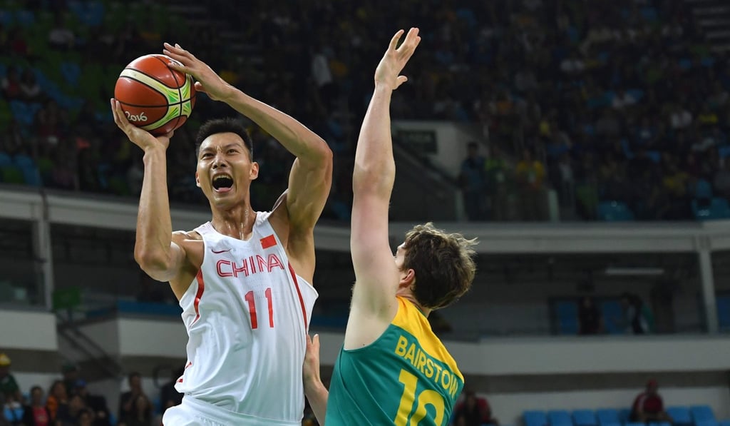 China's forward Yi Jianlian goes to the basket against Australia's Cameron Bairstow at the Olympics last summer. Photo AFP