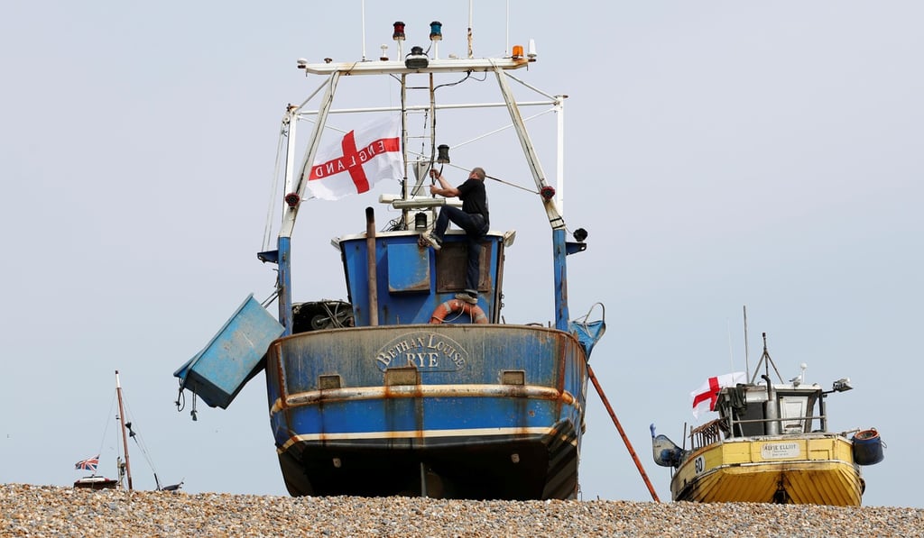 Fishing boats fly the St George’s Cross flag at Hastings in southeast England. Photo: Reuters