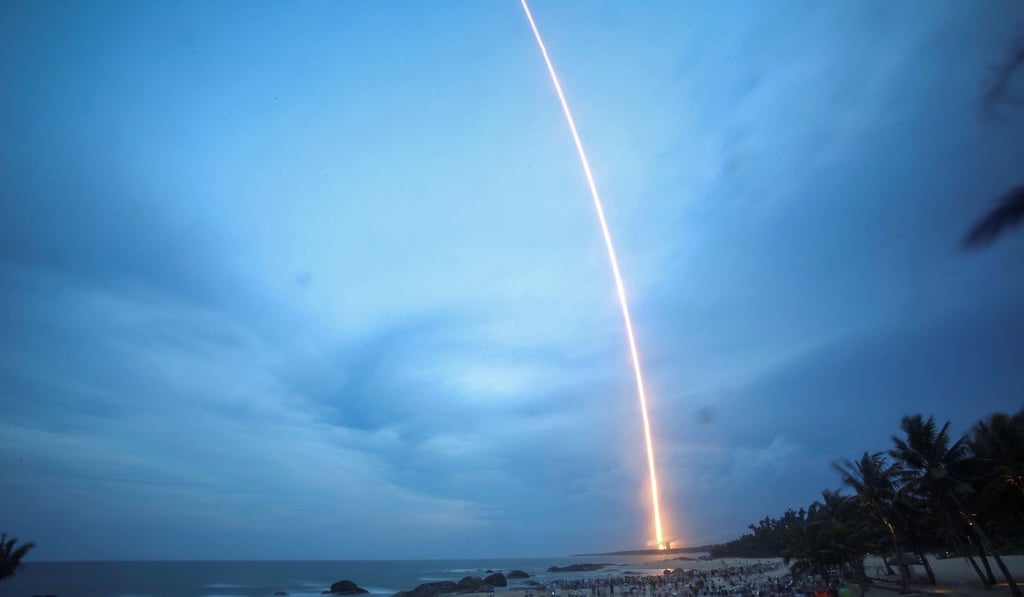 Spectators view the launch of the Long March 5 rocket near the Wenchang Satellite Launch Centre in Hainan Island on Sunday. Photo: Reuters