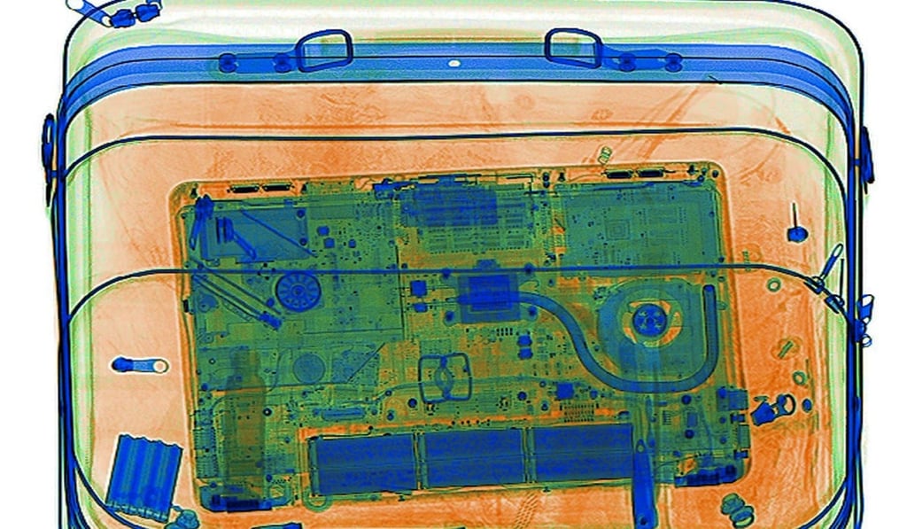 An illustration picture shows a laptop on the screen of an X-ray security scanner. Photo: Reuters
