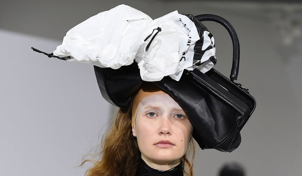 A model presents a hat made out of a plastic bag and a handbag, by A.F. Vandevorst, in Paris on Sunday. Photo: AFP