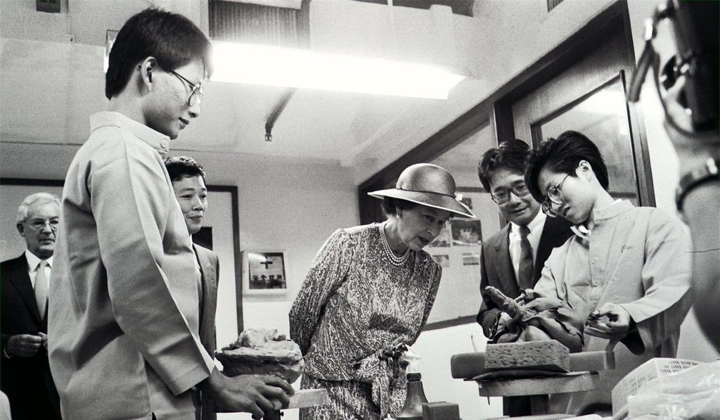 A Hong Kong Polytechnic student explained to Queen Elizabeth II how an invention works during her visit to the college's technology and community care displays