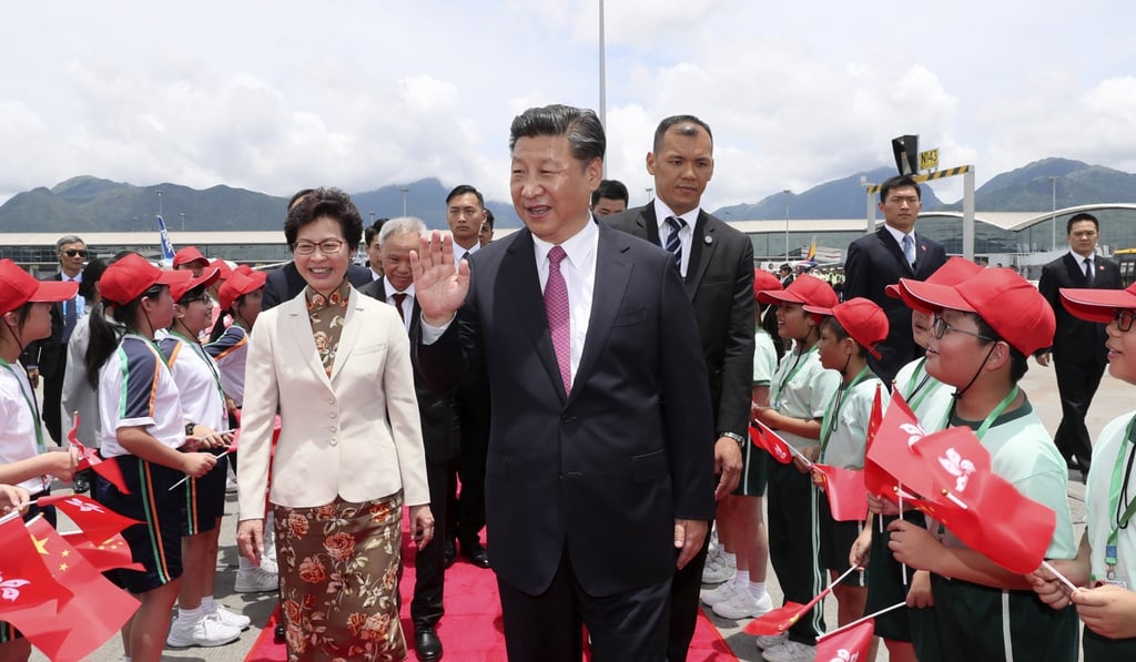 President Xi Jinping waves to the crowds as he wraps up his visit to Hong Kong and is seen off by Chief Executive Carrie Lam and other officials, on July 1. Photo: Xinhua President Xi Jinping waves to the crowds as he wraps up his visit to Hong Kong and is seen off by Chief Executive Carrie Lam and other officials, on July 1. Photo: Xinhua