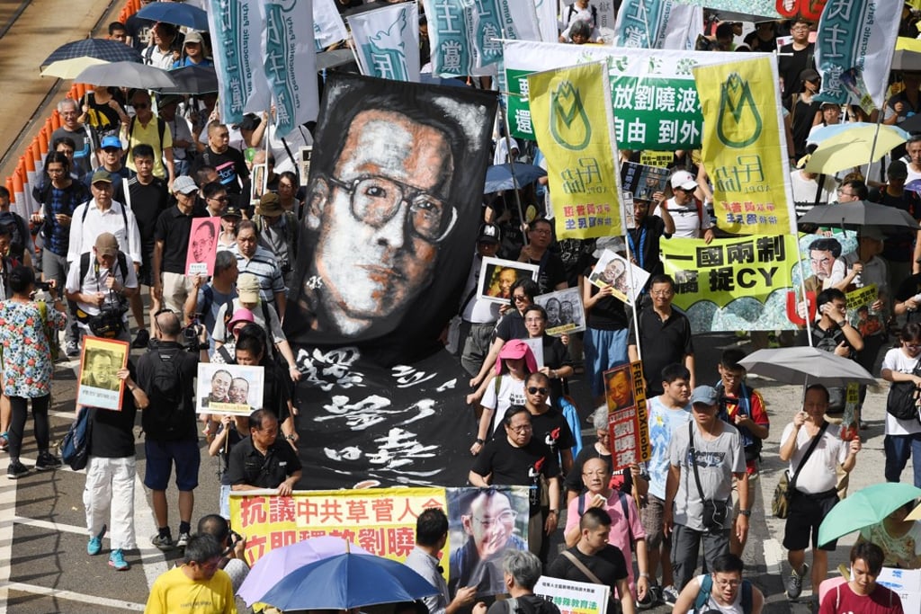 Pro-democracy protesters demand freedom for the terminally ill Liu Xiaobo during the July 1 march in Hong Kong this year. Photo: Kyodo