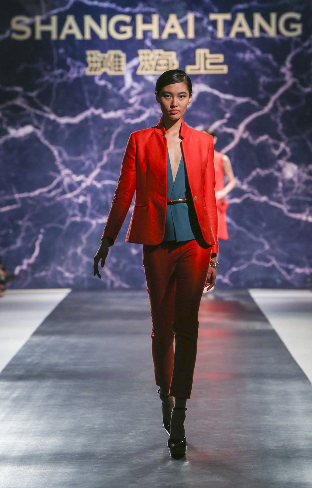 Model on the catwalk during Shanghai Tang's 20th anniversary celebration in Shanghai presenting it's spring/summer 2015 collection