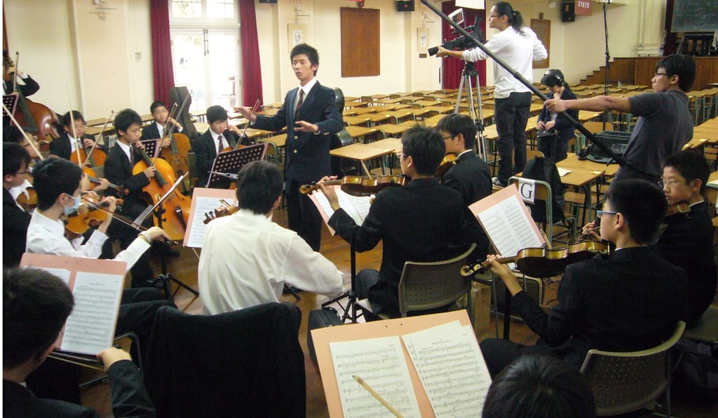 Wong Ka-jeng conducts his school's orchestra during the shooting of KJ – Music & Life. Photo: Cheung King-wai