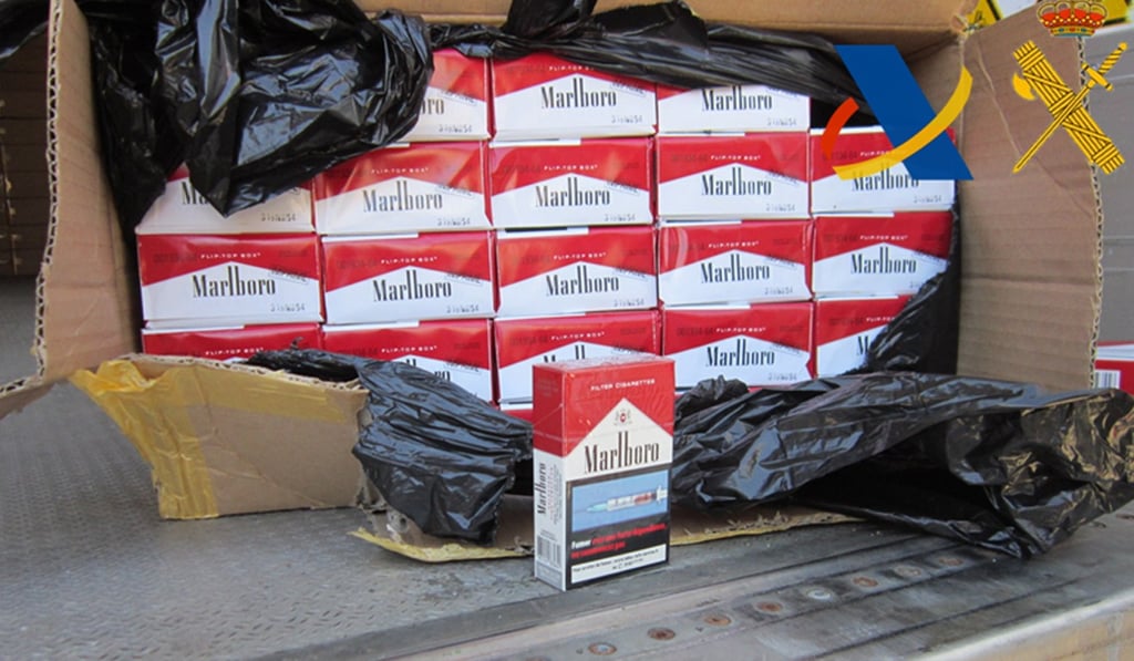 Counterfeit packs of cigarettes were seized by Spanish police that were smuggled in from China and are bound for France. Paris is considering a move to raise the price of a pack of cigarettes to 11 euros. Photo: AFP