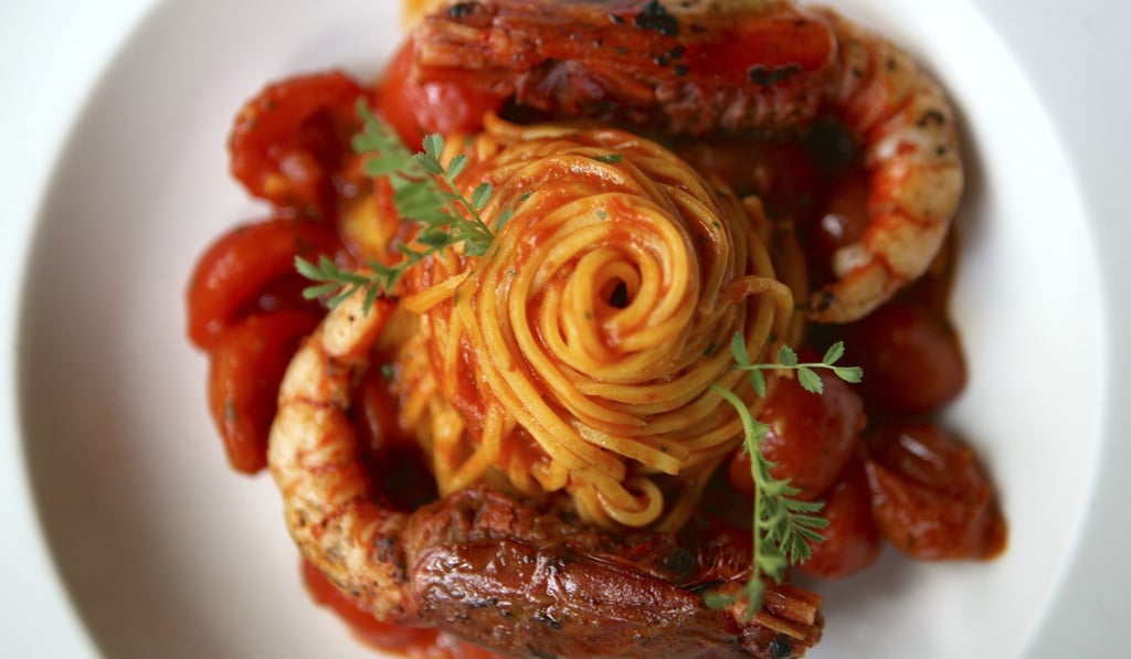 House-made tagliolini arrabbiata with pan-fried red prawns.