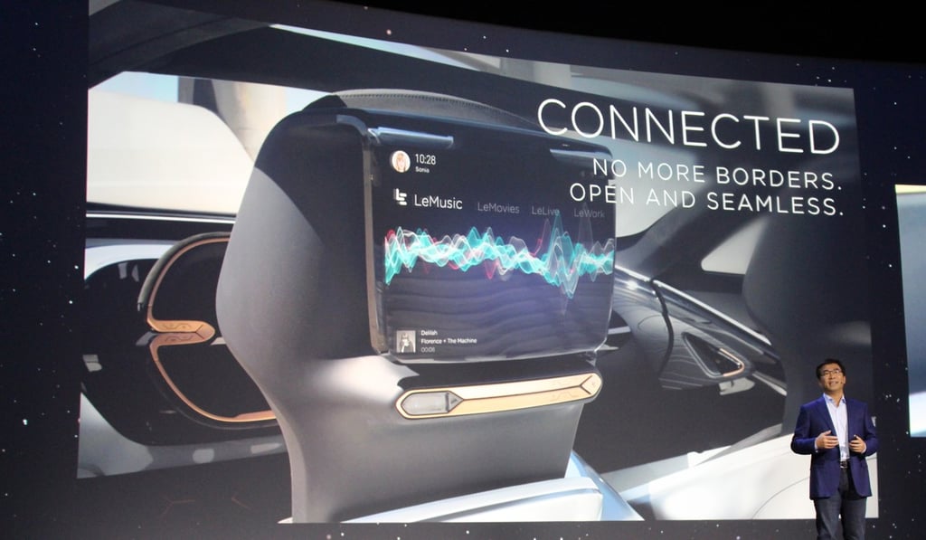 LeEco co-founder Lei Ding provides details about development of self-driving electric cars synched to the internet. Photo: AFP