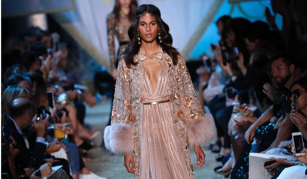 Like the locks, gowns also flowed long at Elie Saab. Photo: AFP Like the locks, gowns also flowed long at Elie Saab. Photo: AFP