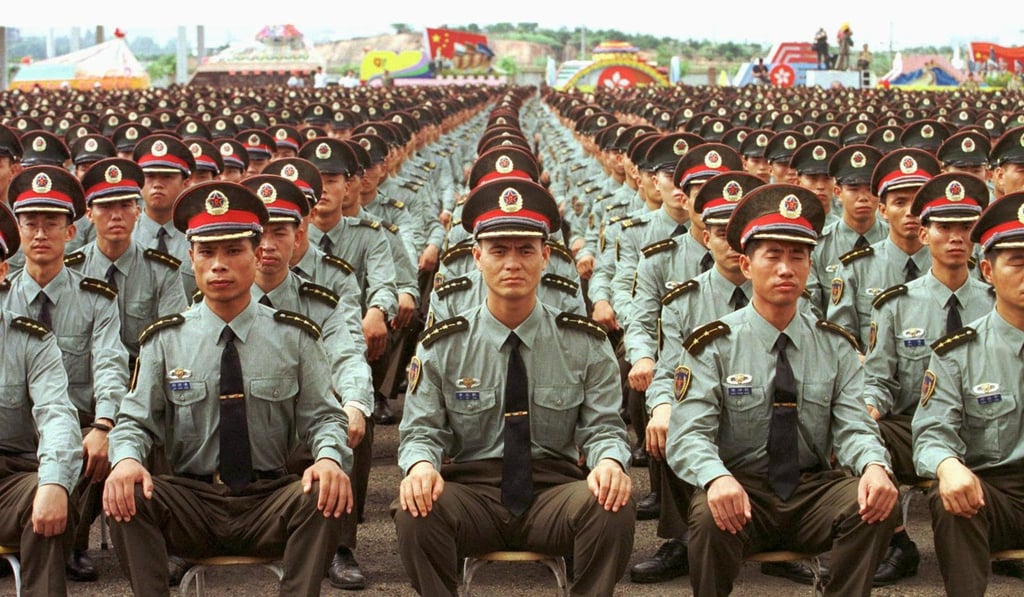 PLA troops in Shenzhen on June 30, 1997, during a farewell ceremony before crossing the border into Hong Kong on July 1. Picture: Reuters