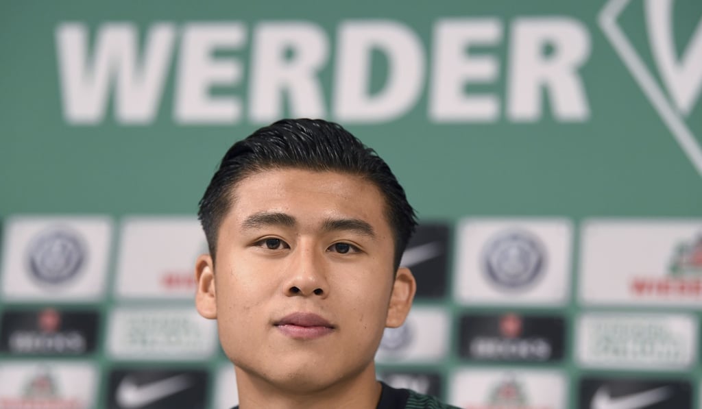 Werder Bremen's new signing Zhang Yuning smiles at a press conference. Photo: Carmen Jaspersen/dpa via AP Werder Bremen's new signing Zhang Yuning smiles at a press conference. Photo: Carmen Jaspersen/dpa via AP