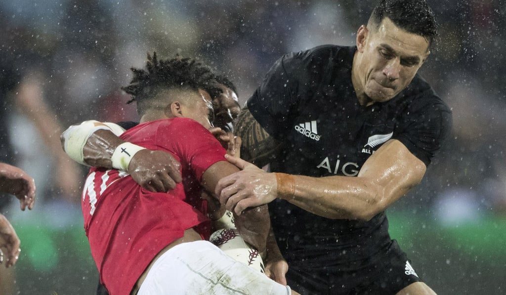 New Zealand inside centre Sonny Bill Williams (right) tackles Lions winger Anthony Watson. Photo: AP