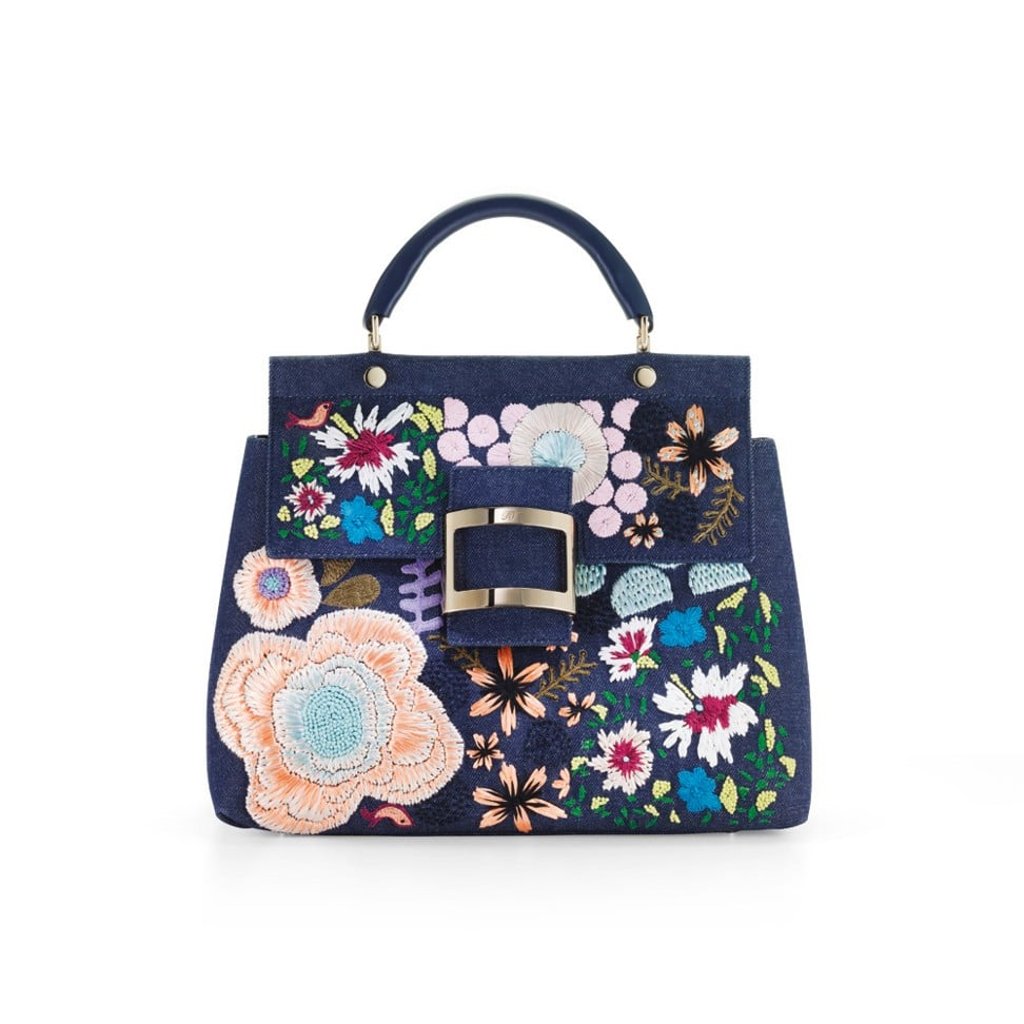 The bag, crafted in denim and embroidered with flowers, features a metal buckle and a removable shoulder strap. It’s perfect for summer, HK$28,900