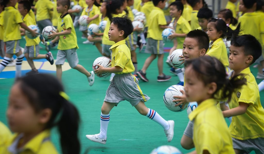 Children play during a football festival at the Central Kindergarten in Changxing county, Zhejiang province, last month. President Xi Jinping’s hobby has become a nation’s goal. Photo: Xinhua
