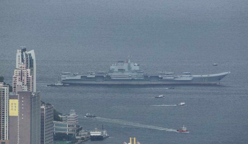 The Liaoning arrives in Victoria Harbour, as seen from theInternational Commercial Centre, Kowloon. Photo: Xiaomei Chen