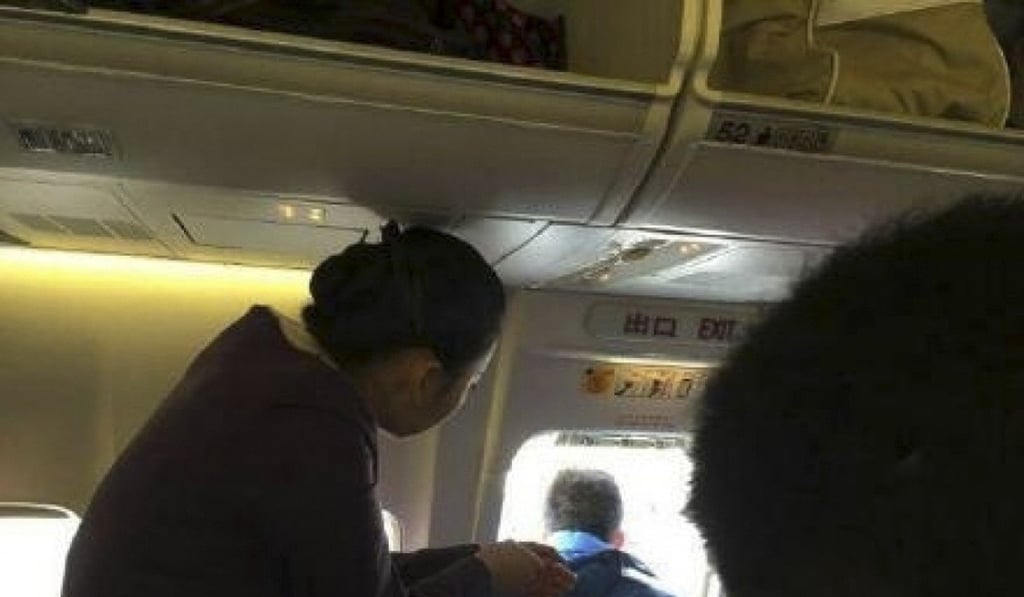 This first-time traveller opened the plane’s emergency exit door to get some fresh air. Photo: SCMP Pictures