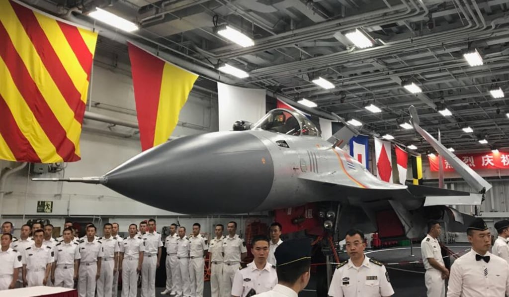 A photo of a J-15 fighter jet inside the hangar on the Liaoning. Photo: Chow Chung-Yan