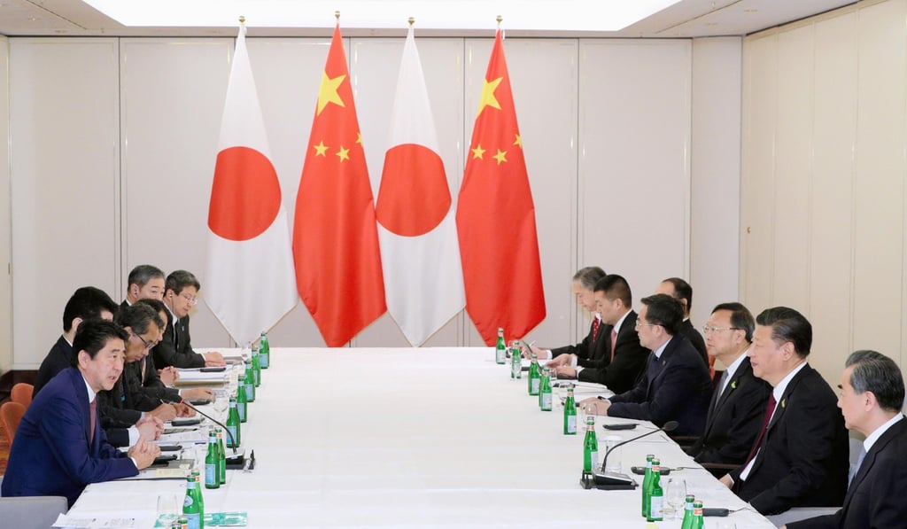 Japanese Prime Minister Shinzo Abe (left) and Chinese President Xi Jinping (second from right) during their half-hour meeting on the sidelines of the G20 summit in Hamburg, Germany. Photo: Kyodo Japanese Prime Minister Shinzo Abe (left) and Chinese President Xi Jinping (second from right) during their half-hour meeting on the sidelines of the G20 summit in Hamburg, Germany. Photo: Kyodo
